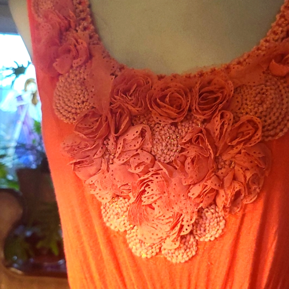 Gorgeous coral color dress.